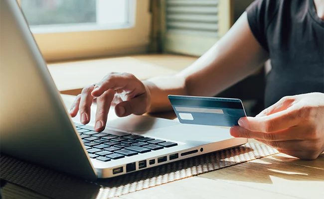 woman paying with a credit card